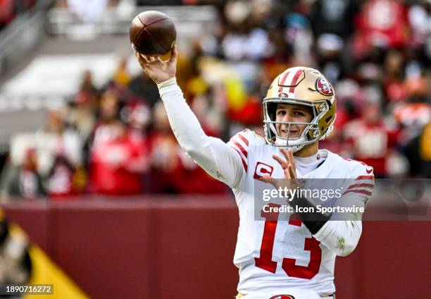San Francisco 49ers quarterback Brock Purdy keeps warm on the sidelines during the NFL game between the San Francisco 49ers and the Washington...