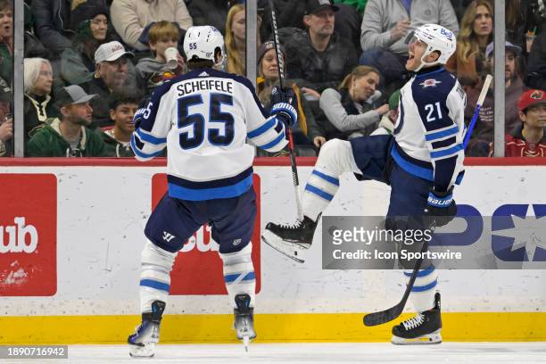 Winnipeg Jets Center Dominic Toninato celebrates his goal with Winnipeg Jets Center Mark Scheifele during the third period of an NHL game between the...