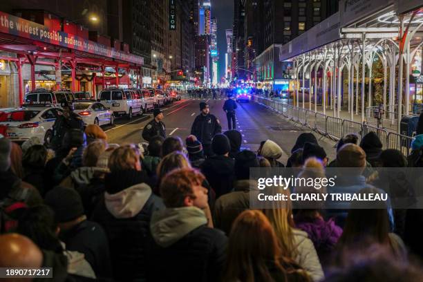 Revelers gather to celebrate New Year's Eve in Times Square on December 31 in New York City.