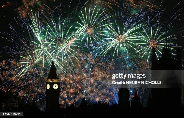 Fireworks explode around the London Eye and The Elizabeth Tower, commonly known by the name of the clock's bell, "Big Ben", at the Palace of...