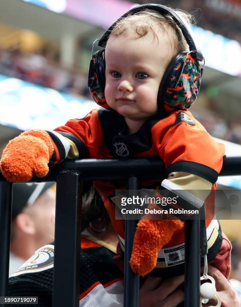 Anaheim Ducks fan smiles during the first period against the Edmonton Oilers at Honda Center on December 31, 2023 in Anaheim, California.