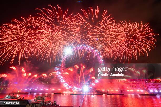Fireworks light up the London sky over the London Eye on the River Thames to celebrate the new year in United Kingdom on January 1, 2024.