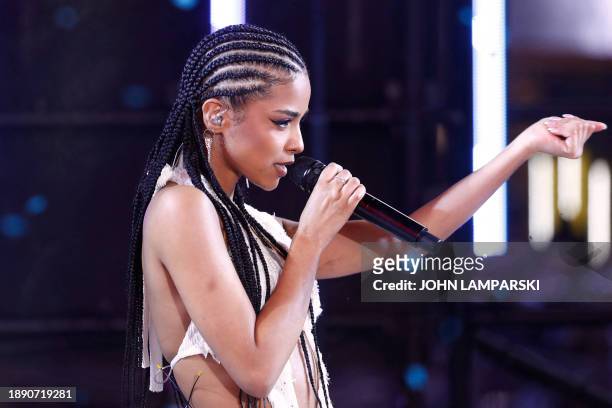 South African singer Tyla performs as revelers celebrate New Year's Eve in Times Square on December 31 in New York City.