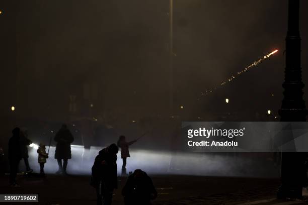 People gather to celebrate the new year in the Heroes' Square in Budapest, Hungary on January 01, 2024.