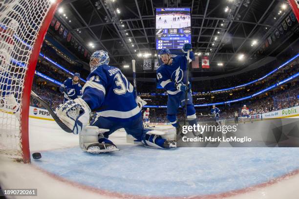 Goalie Jonas Johansson of the Tampa Bay Lightning makes a save against Sean Monahan of the Montreal Canadiens during the first period at Amalie Arena...