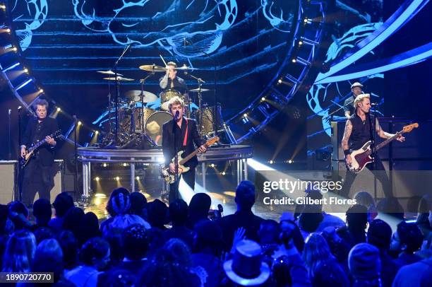 In this image released on December 31 Tré Cool, Billie Joe Armstrong and Mike Dirnt of Green Day perform during Dick Clark's New Year's Rockin' Eve...