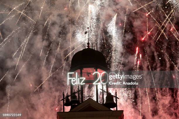 People welcome the year 2024 at Puerta del Sol in Madrid, Spain on January 01, 2024. The city of Madrid welcomes the year 2024 with the Plaza del Sol...