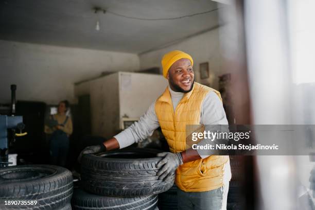 this tire is ready to be used - yellow glove stock pictures, royalty-free photos & images