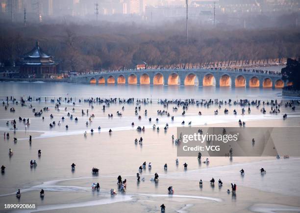 Tourists have fun at Summer Palace Ice Rink on December 28, 2023 in Beijing, China. Summer Palace Ice Rink opened to visitors from December 28.