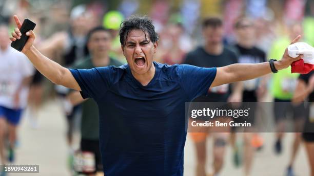 powerful marathon finish line celebration moment - running marathon finish line stock pictures, royalty-free photos & images