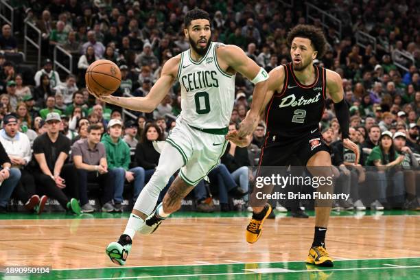 Jayson Tatum of the Boston Celtics drives to the basket against Cade Cunningham of the Detroit Pistons during the second quarter at TD Garden on...