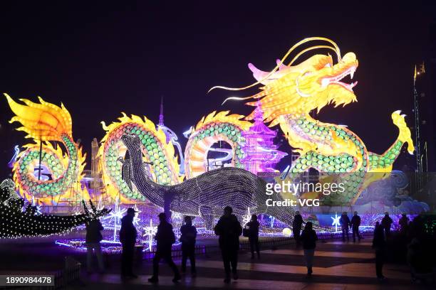 People view a dragon-shaped lantern in a lantern show ahead of the Chinese New Year on December 28, 2023 in Changzhou, Jiangsu Province of China. The...