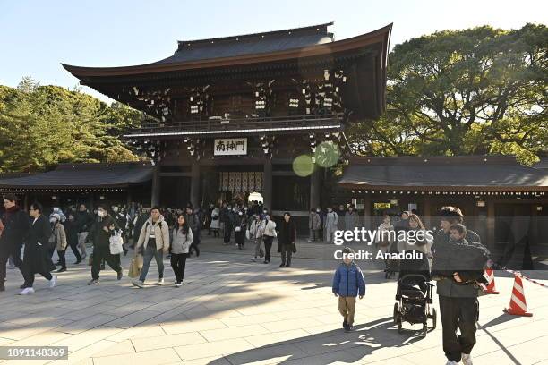 People pray for the New Year at the Meiji Shrine on January 1st, 2024 in Tokyo, Japan. Japanese go to Shrine to celebrate Year of Dragon and ask for...