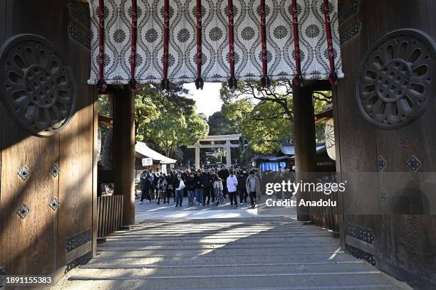 People pray for the New Year at the Meiji Shrine on January 1st, 2024 in Tokyo, Japan. Japanese go to Shrine to celebrate Year of Dragon and ask for...