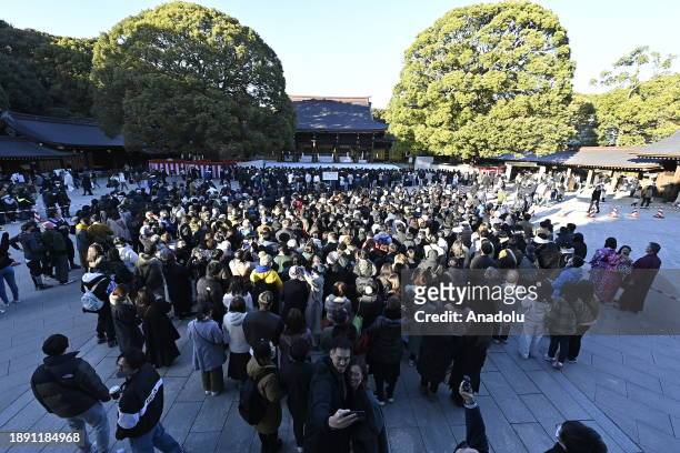 People pray for the New Year at the Meiji Shrine on January 1st, 2024 in Tokyo, Japan. Japanese go to Shrine to celebrate Year of Dragon and ask for...