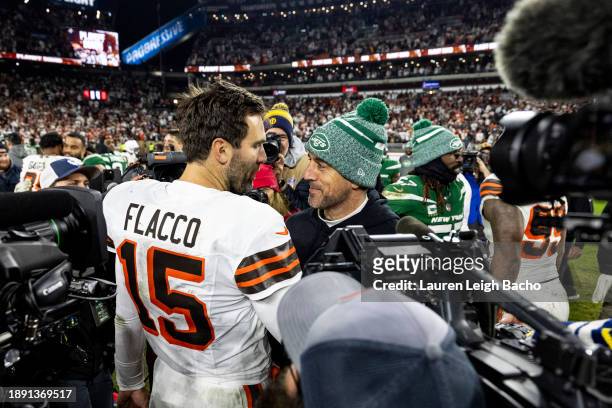 Joe Flacco of the Cleveland Browns hugs Aaron Rodgers of the New York Jets after the game at Cleveland Browns Stadium on December 28, 2023 in...