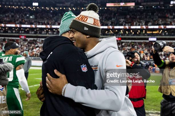 Deshaun Watson of the Cleveland Browns hugs Aaron Rodgers of the New York Jets after the game at Cleveland Browns Stadium on December 28, 2023 in...