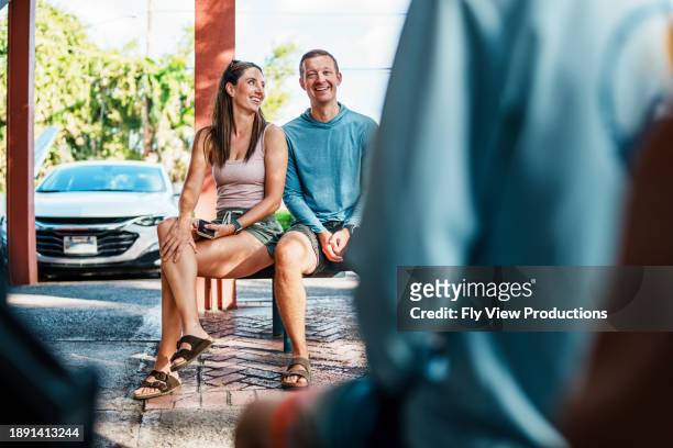 happy couple outside shave ice shoppe in hawaii - shoppe stock pictures, royalty-free photos & images