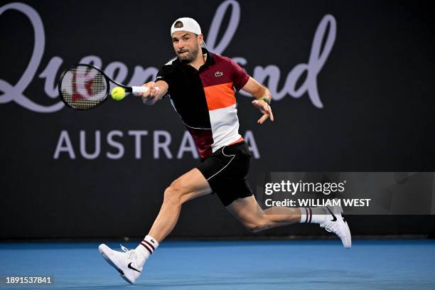 Bulgaria's Grigor Dimitrov hits a return against Britain's Andy Murray during their men's singles match at the Brisbane International tennis...