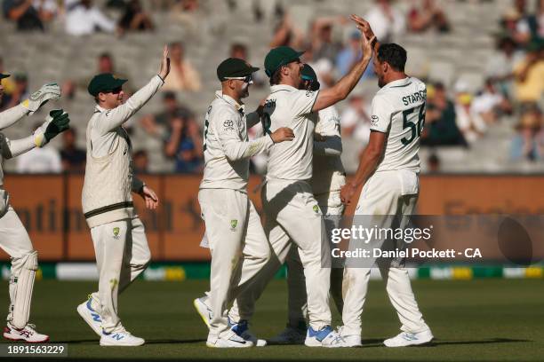 Mitchell Marsh of Australia and Mitchell Starc of Australia celebrate the dismissal of Salman Ali Agha of Pakistan during day four of the Second Test...