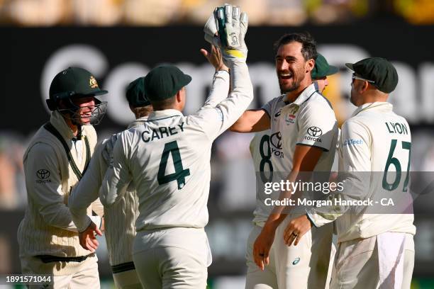 Mitchell Starc of Australia celebrates the wicket of Salman Ali Agha of Pakistan during day four of the Second Test Match between Australia and...