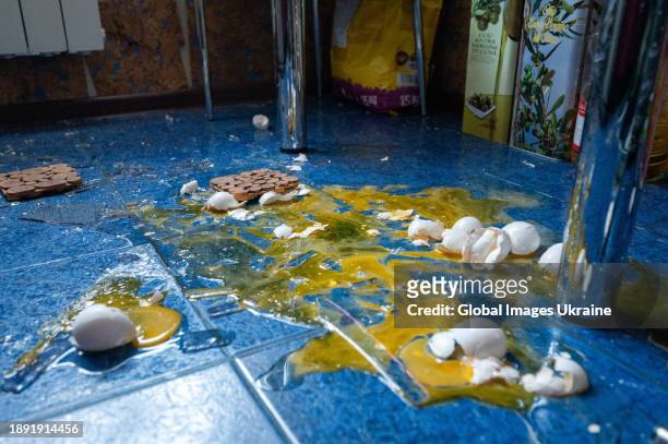 Chicken eggs lie broken on the floor of a kitchen, damaged by a Russian missile strike on December 29, 2023 in Lviv, Ukraine. Russia launched a mass...