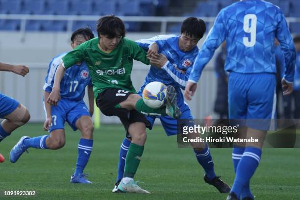 Yuto Nakajima of Nara Ikuei and Hiroto Nishijima of Shohei compete for the ball during the 102nd All Japan High School Soccer Tournament first round...