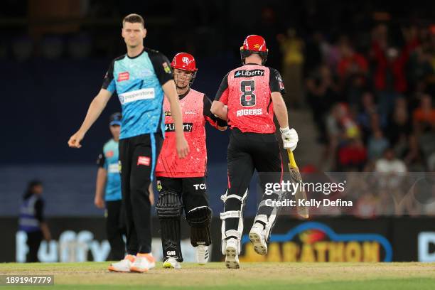 Adam Zampa of the Renegades and Tom Rogers of the Renegades celebrate winning during the BBL match between Melbourne Renegades and Adelaide Strikers...