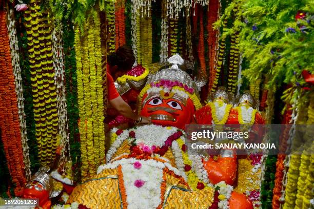 Hindu priest performs rituals on the occasion of New Year's day at a temple near Sangam, the confluence of rivers Ganga, Yamuna and mythical...