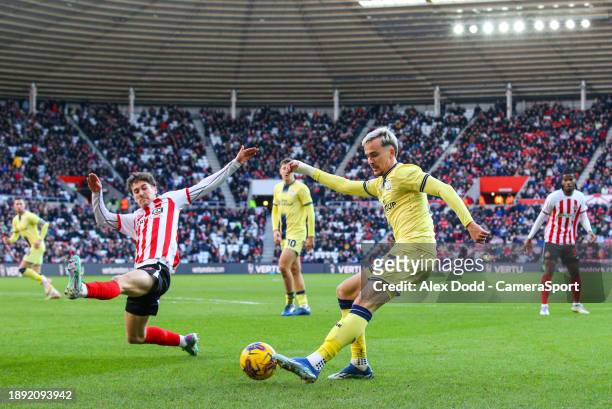 Preston North End's Liam Millar crosses under pressure from Sunderland's Trai Hume during the Sky Bet Championship match between Sunderland and...