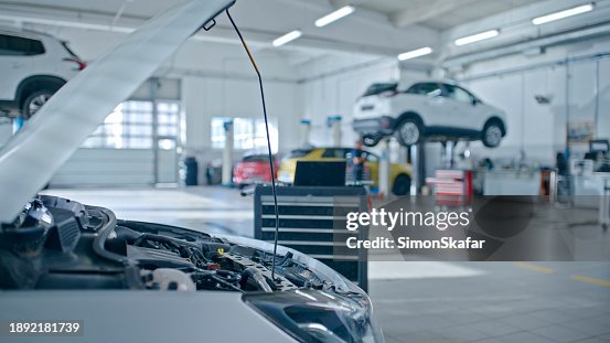 Cars Open Bonnet With Laptop Placed Next To Engine In The Auto Repair Shop Cars Open Bonnet With Laptop Placed Next To Engine In The Auto Repair Shop