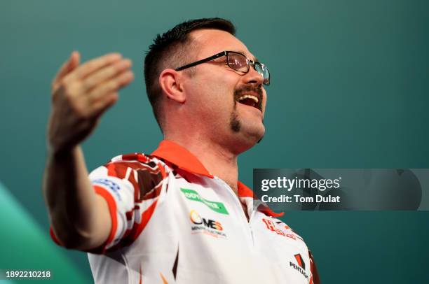 Damon Heta of Australia celebrates winning his round three match against Berry van Peer of Netherlands on day 12 of the 2023/24 Paddy Power World...