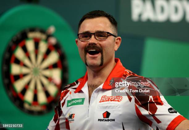 Damon Heta of Australia celebrates winning his round three match against Berry van Peer of Netherlands on day 12 of the 2023/24 Paddy Power World...