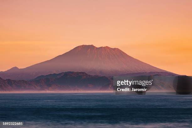 tropical landscape with volcano on bali island at sunrise - agung stock pictures, royalty-free photos & images