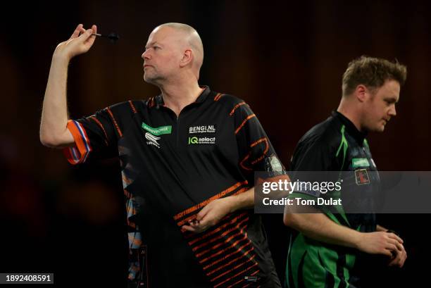 Raymond van Barneveld of Netherlands throws during his round three match against Jim Williams of Wales on day 12 of the 2023/24 Paddy Power World...