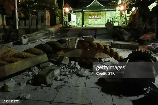 Debris is pictured in the grounds of the Onohiyoshi Shrine in the city of Kanazawa, Ishikawa prefecture, late on January 1 after it was damaged by a...