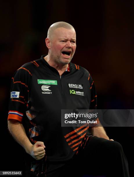 Raymond van Barneveld of Netherlands celebrates winning his round three match against Jim Williams of Wales on day 12 of the 2023/24 Paddy Power...