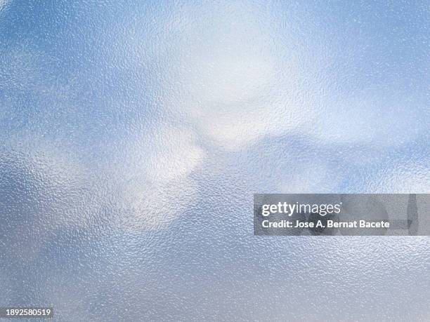 abstract background, translucent glass visual effect with blue sky and clouds. - steamy mirror stock pictures, royalty-free photos & images