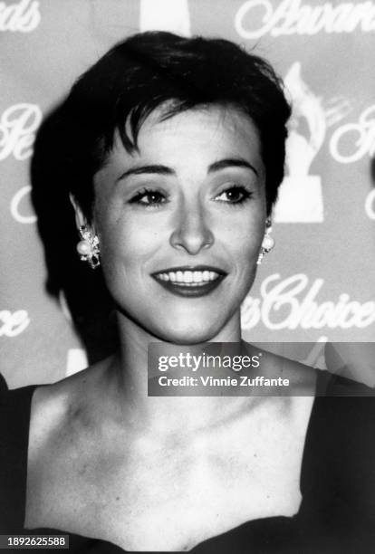 Headshot of British actress Amanda Donohoe, wearing pearl earrings, in the press room of the 17th People's Choice Awards, held at Universal Studios...