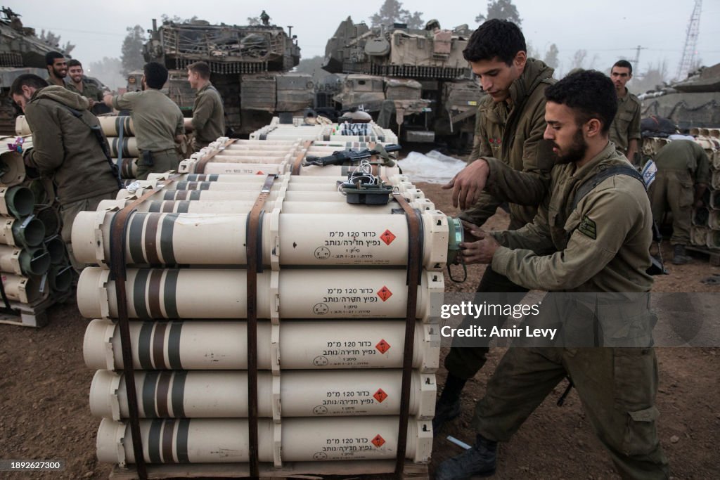 Offensive Shell Israeli soldiers organize tank shells after returning from the Gaza ...