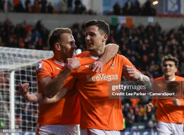 Blackpool's Oliver Casey celebrates scoring the opening goal with Jordan Rhodes during the Sky Bet League One match between Blackpool and Lincoln...