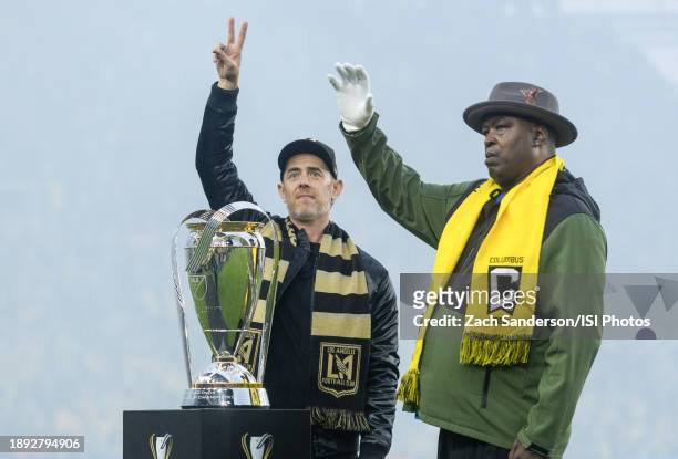 Los Angeles FC supporter Colin Hanks and Columbus Crew supporter Buster Douglas wave to the crowd with the trophy before the Audi 2023 MLS Cup Final...
