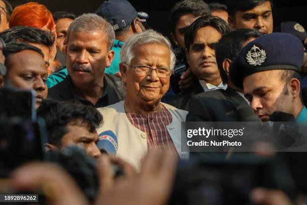 Bangladeshi Nobel Peace Laureate Professor Muhammad Yunus is gesturing in front of the court after being sentenced to six months of imprisonment and...