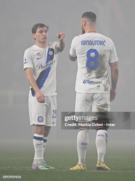 Nicolo Barella of FC Internazionale gestures with Marko Arnautovic during the Serie A TIM match between Genoa CFC and FC Internazionale at Stadio...