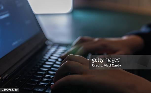 Year-old boy types as he uses a laptop computer on December 19, 2023 in Bath, England. The amount of time children spend on screens each day rocketed...