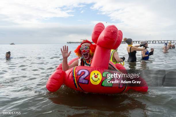 People participate in the 121st annual Polar Bear Plunge in Coney Island on January 1, 2024 in New York City. The New Year's Day event expects some...