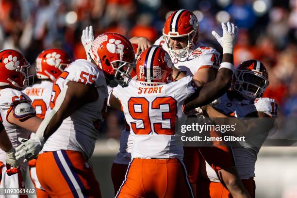 Jonathan Weitz of the Clemson Tigers is hoisted in the air by his teammates after making a field goal during the 4th quarter of the TaxSlayer Gator...