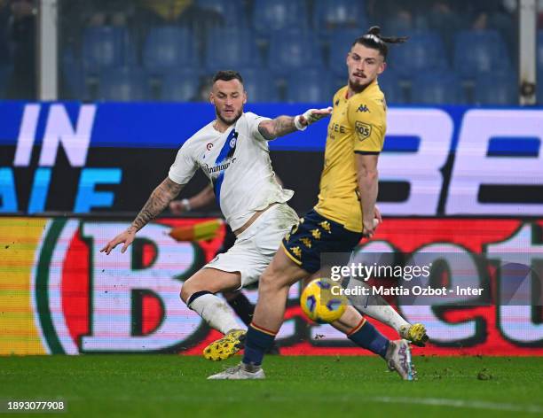 Marko Arnautovic of FC Internazionale competes for the ball with Radu Dragusin of Genoa CFC during the Serie A TIM match between Genoa CFC and FC...