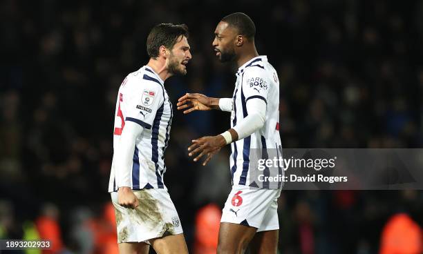 Semi Ajayi of West Bromwich Albion celebrates with team mate Okay Yokuslu after their victory during the Sky Bet Championship match between West...