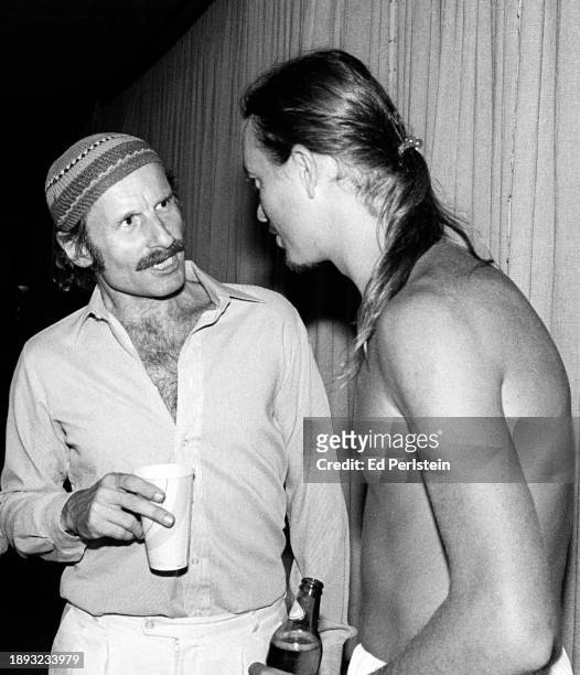 Joe Zawinul and Jaco Pastorius from the band Weather Report talk backstage on May 27, 1979 at the Greek Theater in Berkeley, California.